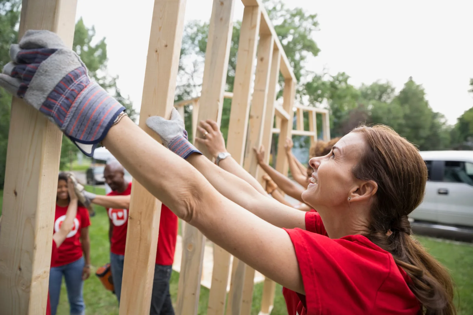 Community volunteers working together to build a home in their neighborhood
